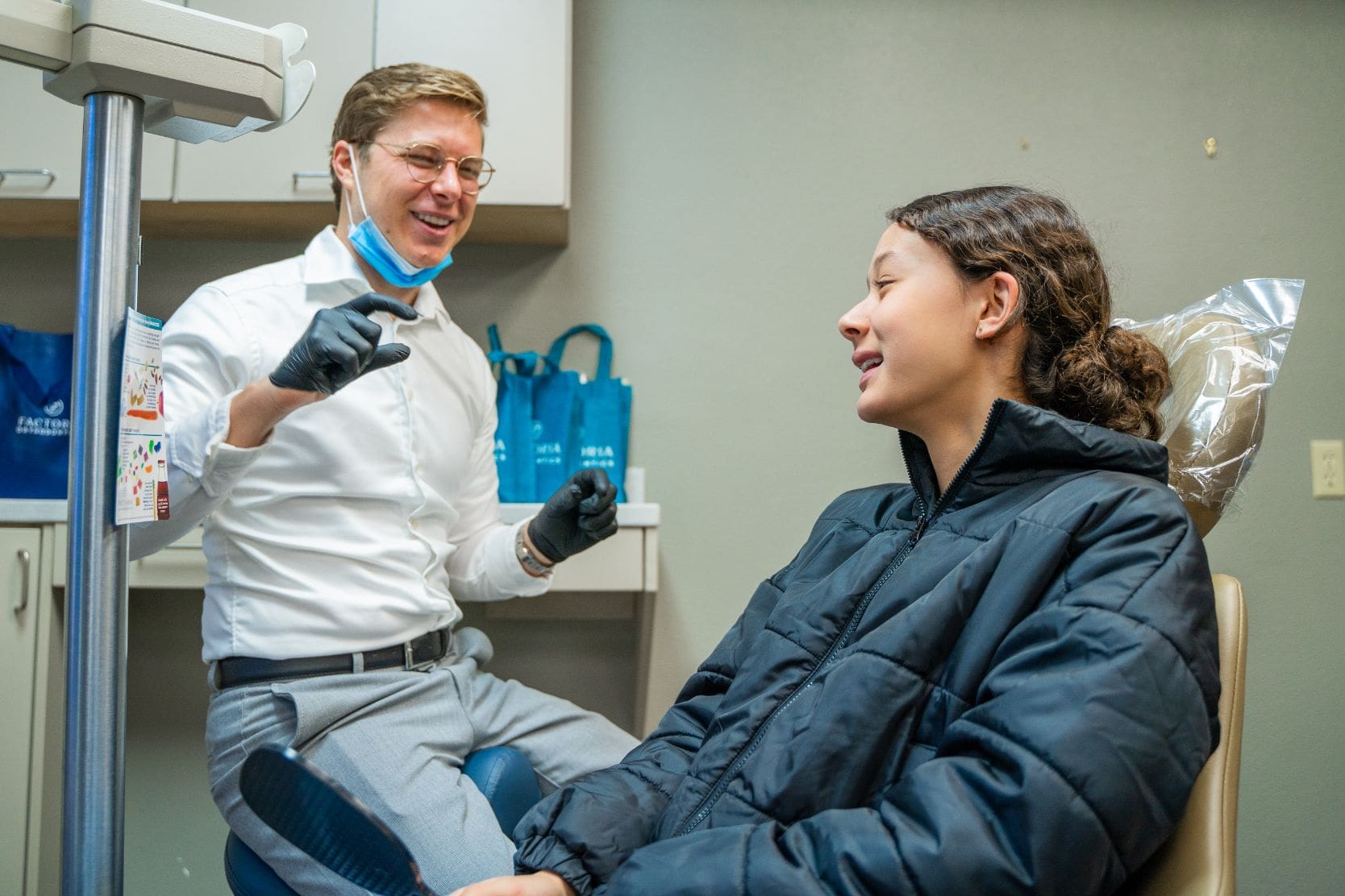 Dr. Adam talking to a teen patient